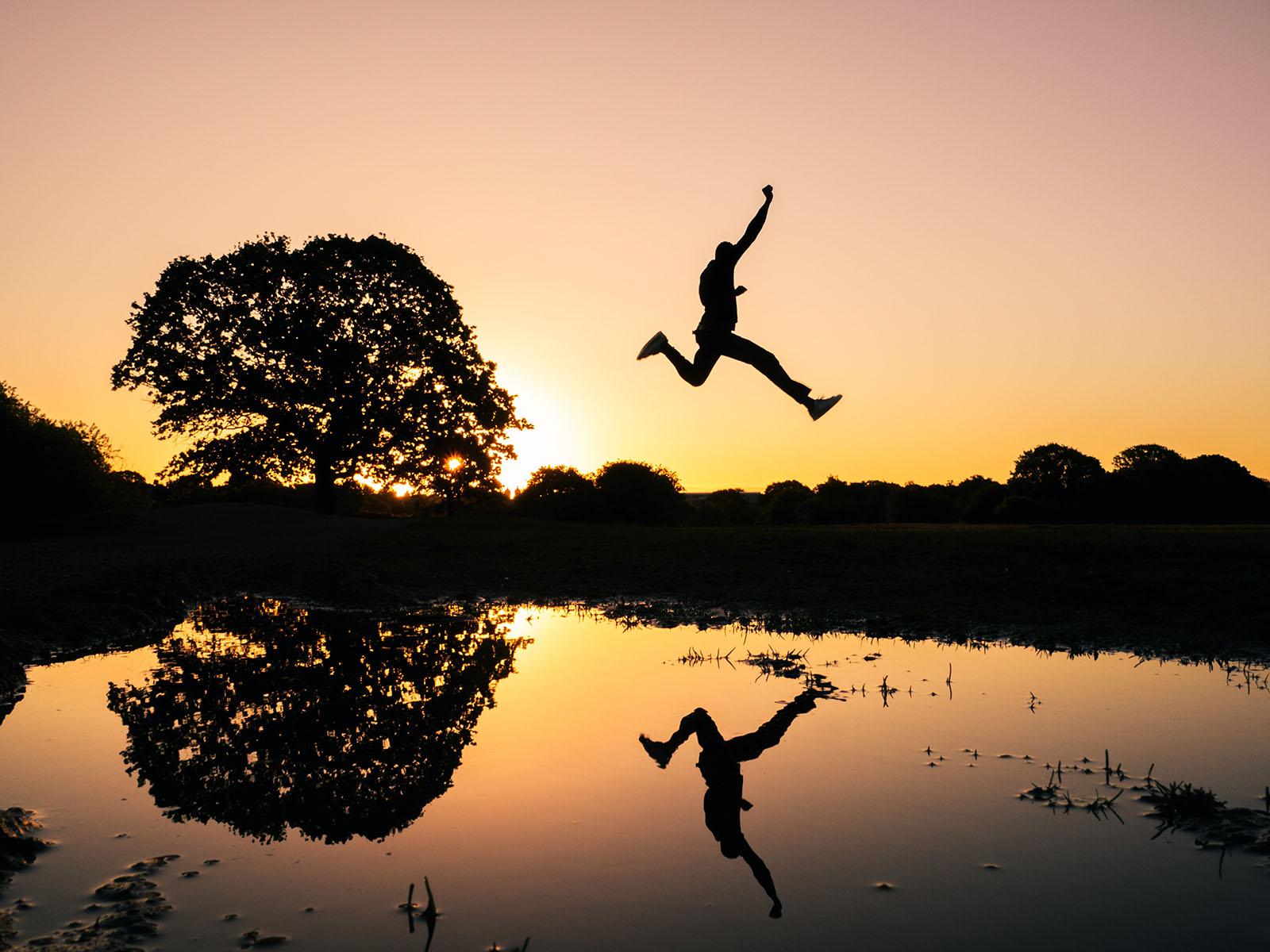 Man jumping over water