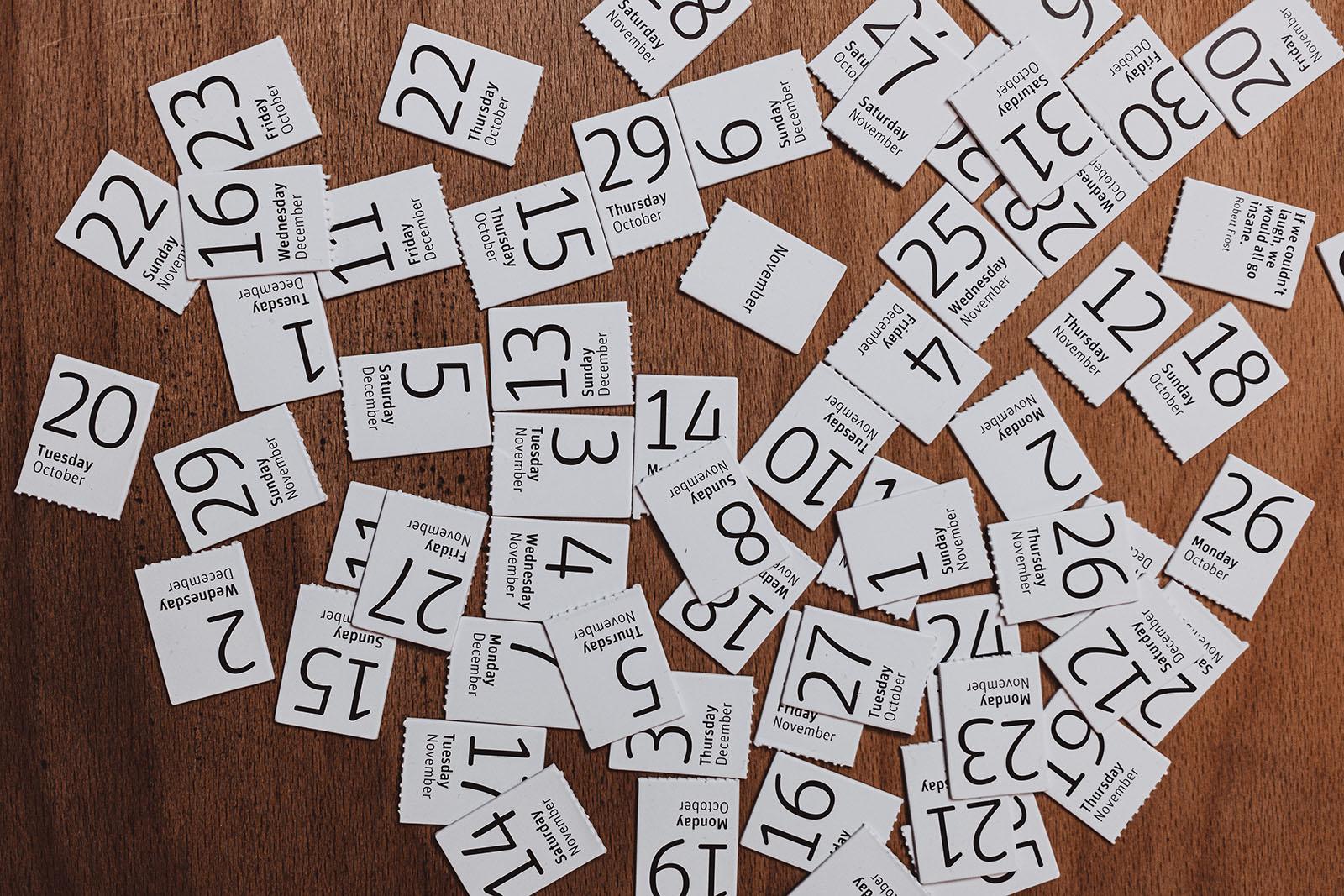 Many calendar cards on a table